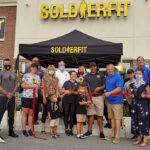 photograph of a ribbon cutting ceremony outside Soldierfit