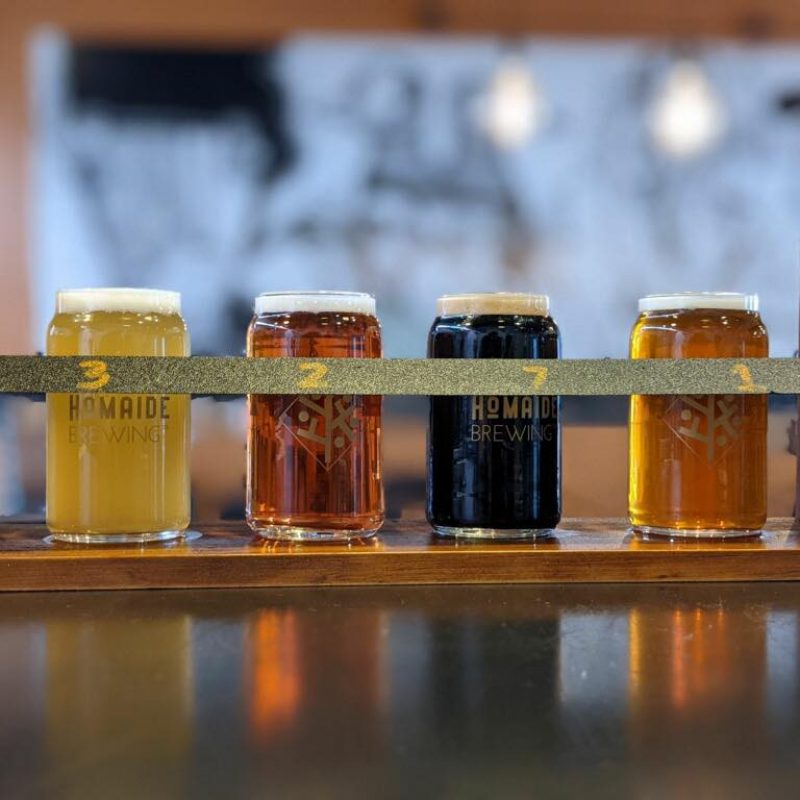 photograph of a beer flight from homaide brewing company