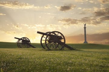 Photo of Antietam battlefield cannons at sunset