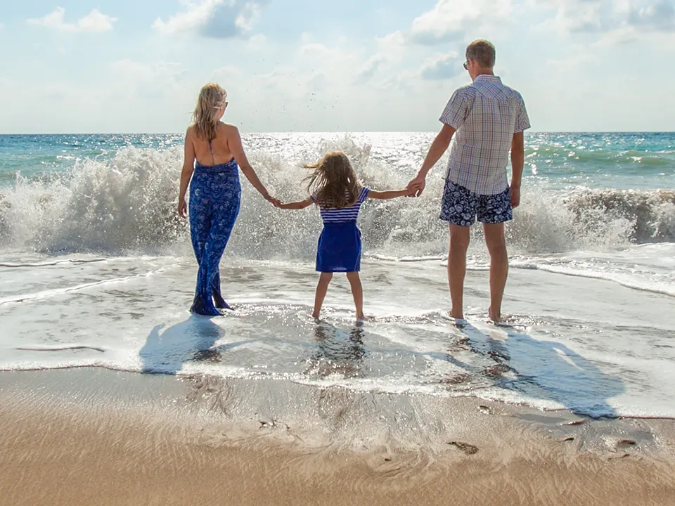 Photo of a family enjoying the beach