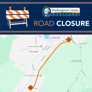 Map and announcement graphic from Washington County, Maryland, showing a road closure near Fort Ritchie. The closure affects a portion of the road between the intersection with MacAfee Hill Road (near Fort Ritchie Road) and Wise Road, passing by landmarks such as The Ritchie History Museum and the Cascade Readiness Center. The graphic includes a roadblock icon and bold text stating "ROAD CLOSURE" under the Washington County Maryland logo.